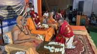 Dharmapracharak Dr. Chaitanya Gulvady receiving blessings from Swamiji-s